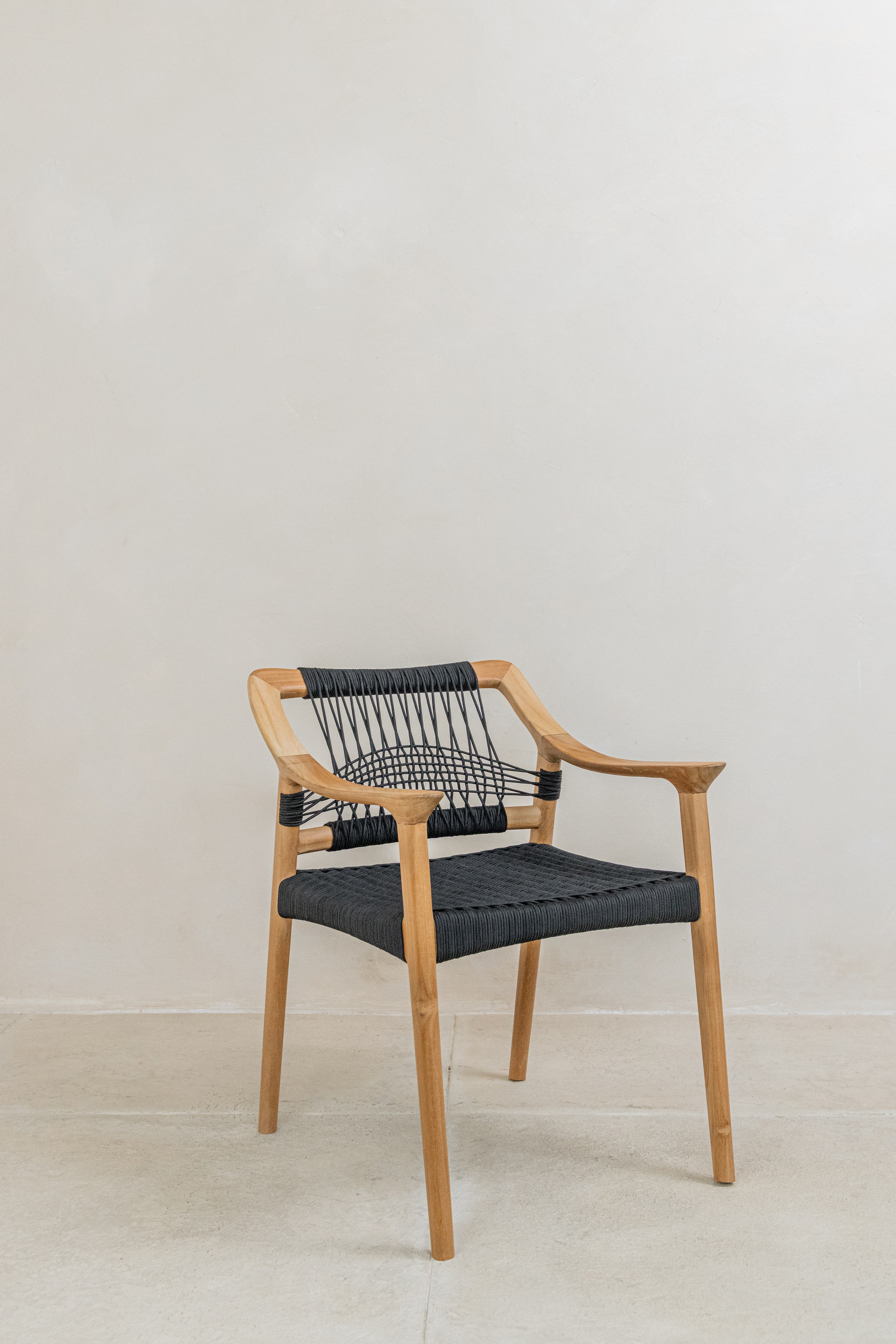 Scandi inspired teak dining chair with black woven rope seat and back