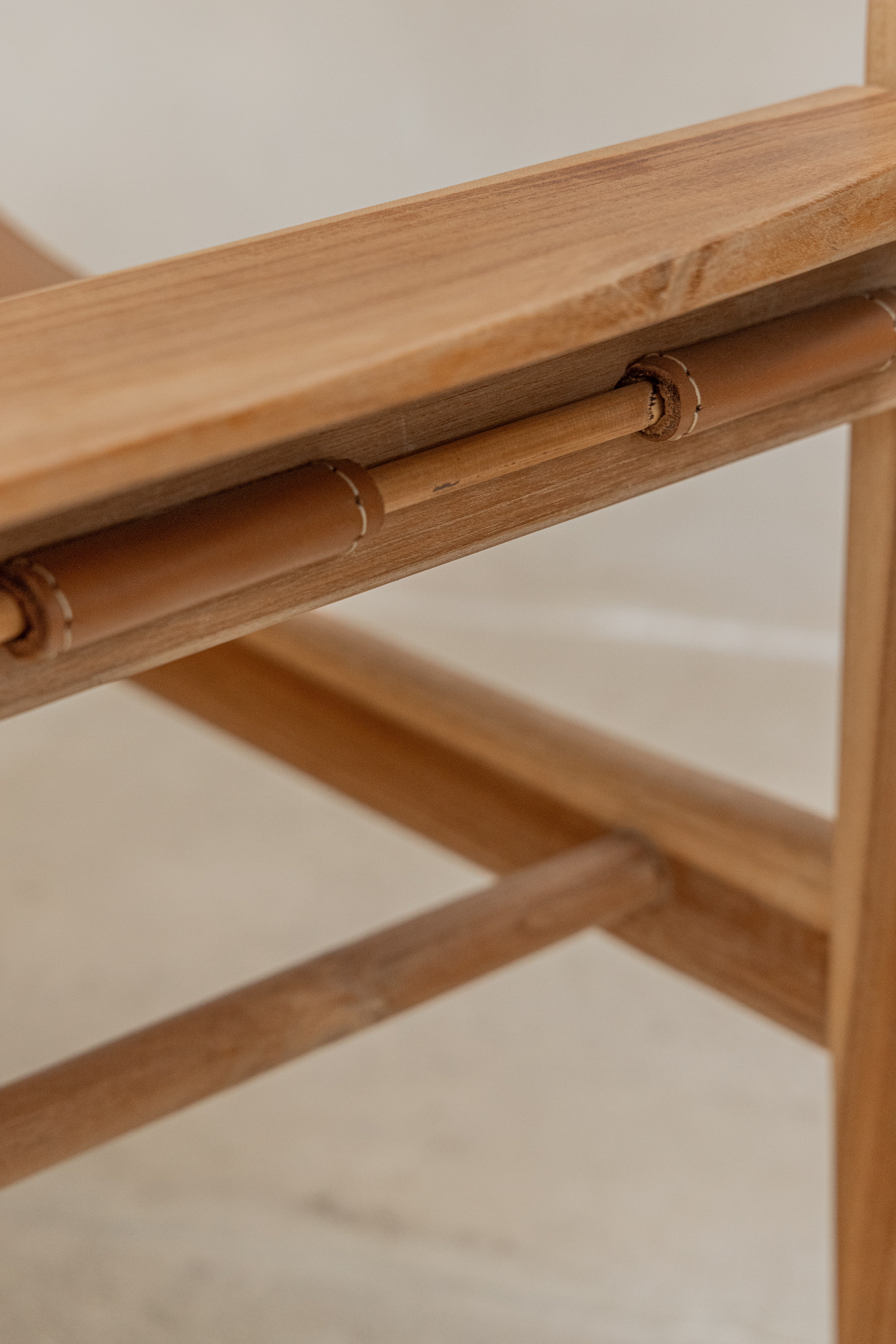 Close up of the hand stitching and joinery of leather seat on the Sergio dining chair