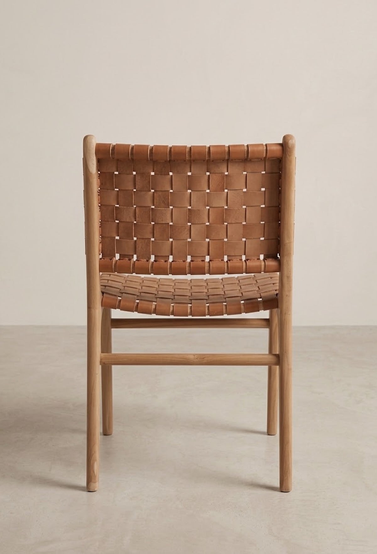 Freja leather cross panel dining chair in natural teak with tan leather rear view