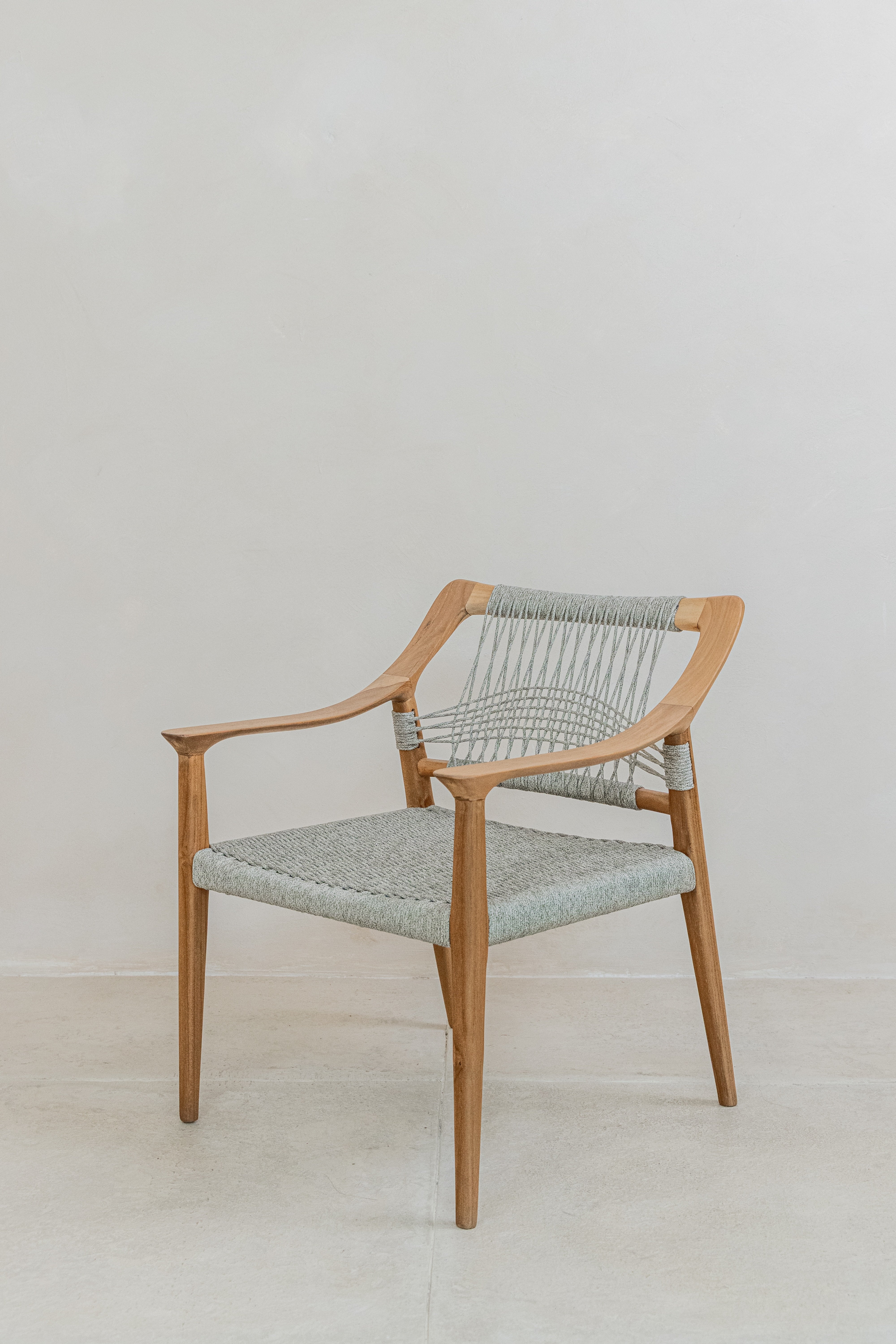 Scandi inspired teak dining chair with a grey woven rope seat