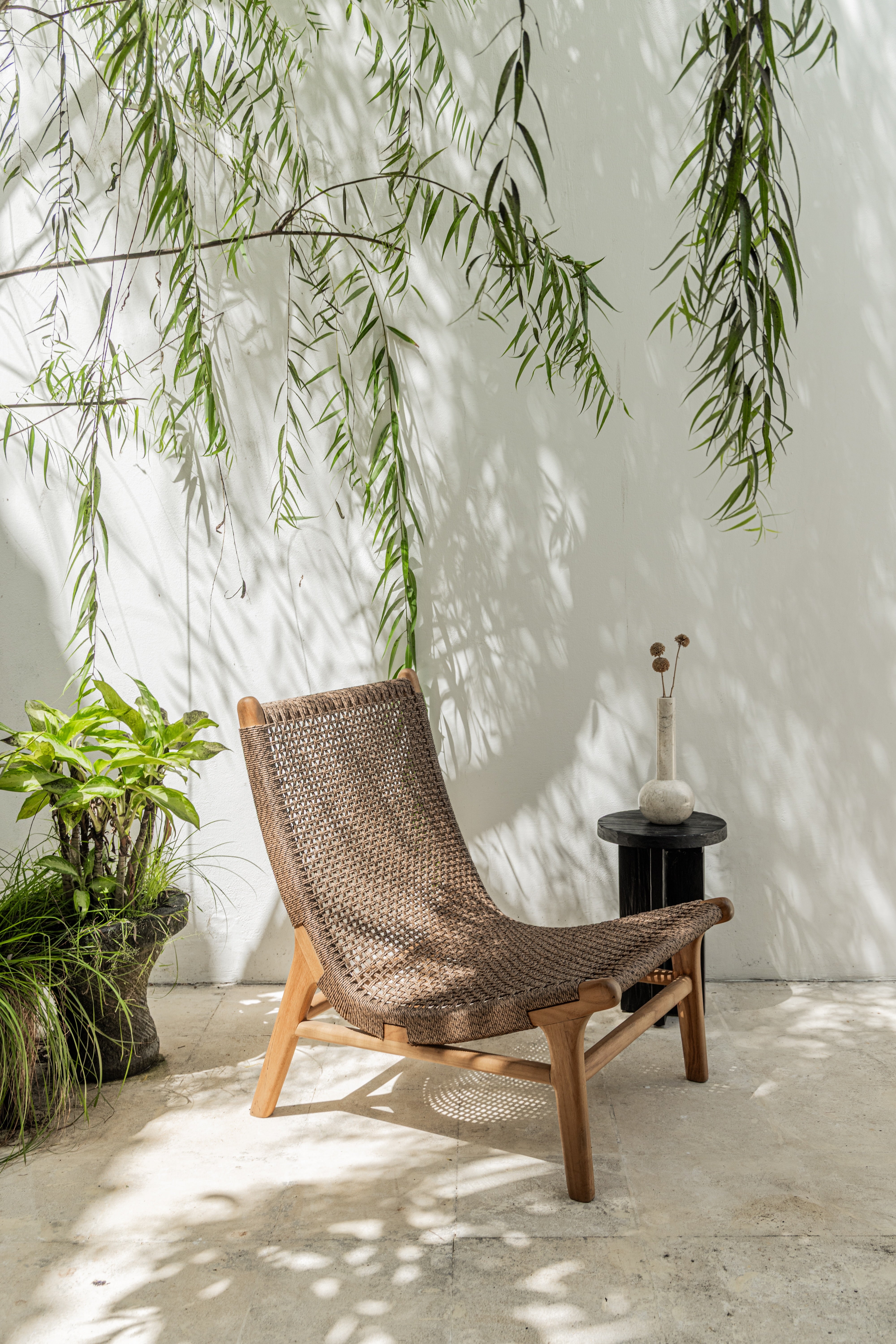 Palma - Spanish inspired indoor outdoor lounge chair in tropical setting
